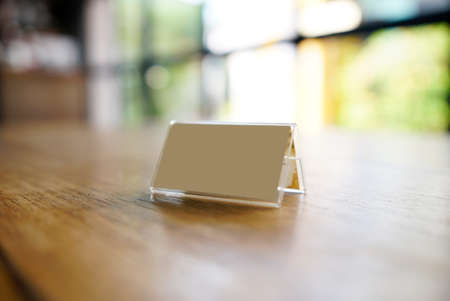 Mock up Menu Frame template on table in coffee shop.     の写真素材