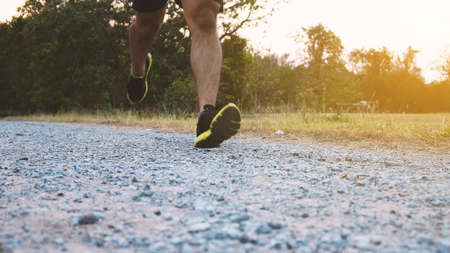 Athlete runner feet running on trail.の写真素材