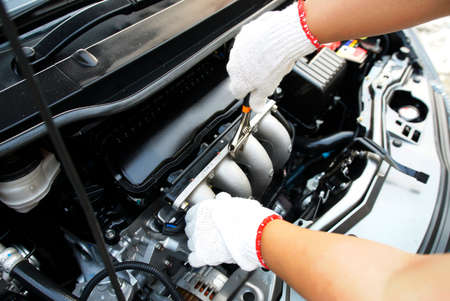 mechanic repairs a car.                            の写真素材
