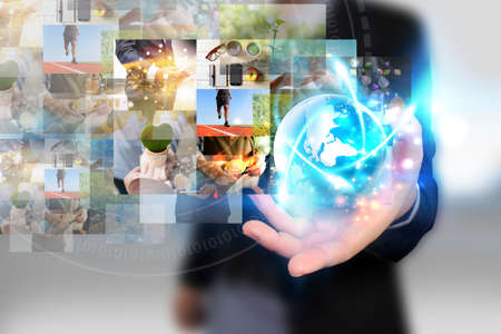 Businessman holding virtual screen. communication using digital technologies conceptの写真素材