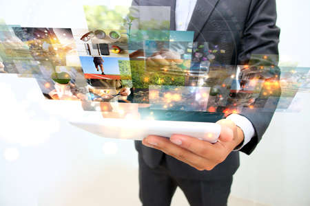 businessman working on smartphone. communication using digital technologiesの写真素材