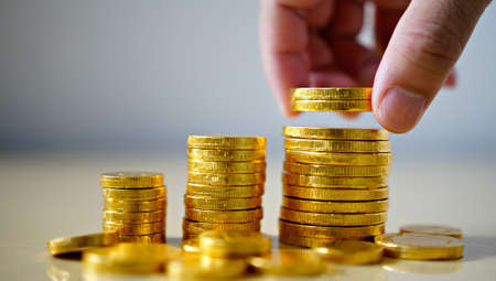 hand putting money coins. Business Growth concept.の写真素材