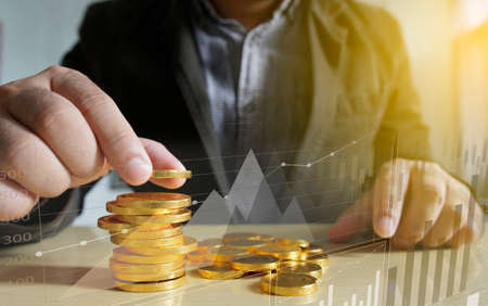 Businessman putting money coins. Business Growth concept.                                      の写真素材
