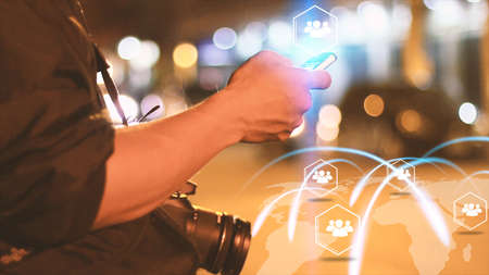 Man tourist finding friends. Navigation concept. map on smartphone, networkingの写真素材