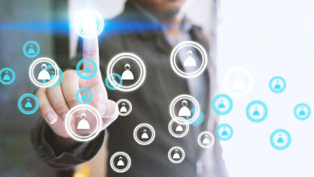 Businessman touching human icon. Social network conceptの写真素材