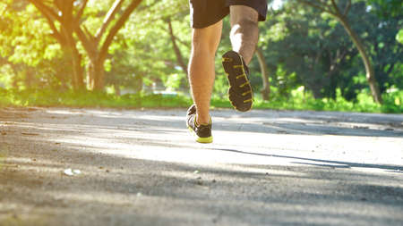 Runner feet running on road.の写真素材