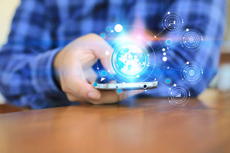 Hand touch screen smart phone, icons interface on screen, Social media, connect to the future concept.の写真素材
