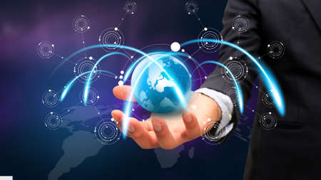 Businessman holding glowing globe. world connected, social network conceptの写真素材