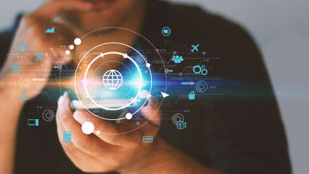 Hand touch screen smart phone, icons interface on screen, Social media, connect to the future concept.の写真素材