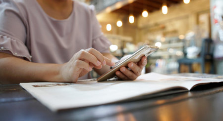 woman using smartphone in cafe.                                