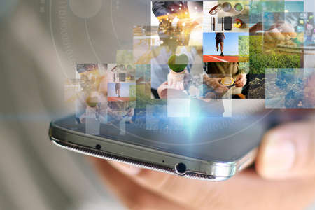 Virtual screen on smartphone. Social media conceptの写真素材
