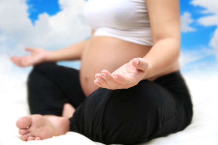 Pregnant woman meditating.の写真素材