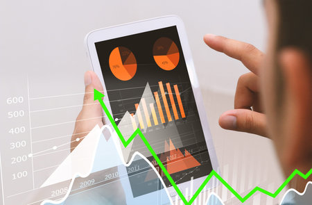Businessman analysis financial paperwork and reports, graph, planning,working at office desk.