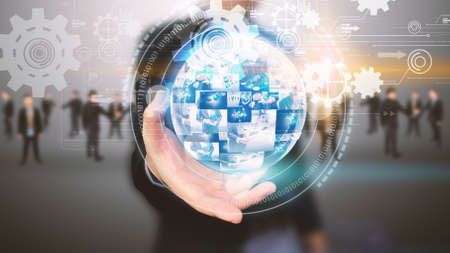 Businessman holding business world with team.の写真素材