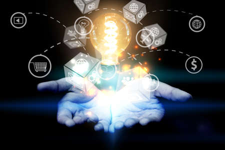 Hand Holding Light Bulb. Creative light bulb. idea concept の写真素材