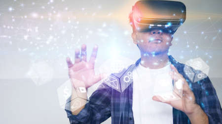 Young man wearing virtual reality glasses. Virtual reality concept.                                  の写真素材