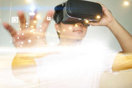 Young man wearing virtual reality glasses. VR glassesの写真素材