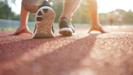 Athlete start running on treadmill. workout wellness concept.  の写真素材
