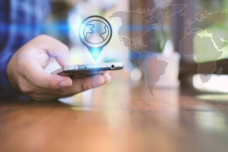 A man using smartphone and check-in on social application.の写真素材