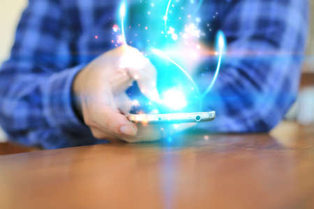 Hand touch screen smart phone.Digital technology concept,Social media,social networkの写真素材