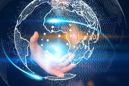 Businessman holding glowing globe. World connected. Social network concept.の写真素材