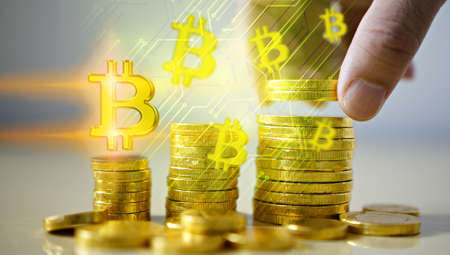 Businessman holding bitcoin symbol. Digital currency, Financial Internet Technology Concept.                                         の写真素材