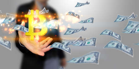 Businessman holding bitcoin symbol. Digital currency, Financial Internet Technology Concept.       の写真素材