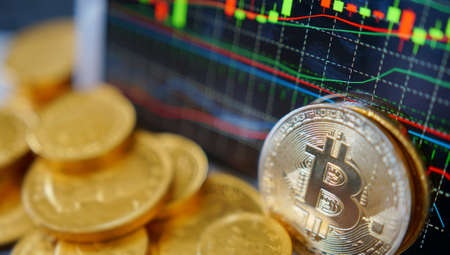 Bitcoin symbol. Financial graph background, crypto currency                               の写真素材