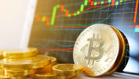 Bitcoin symbol. Financial graph background, crypto currency                               の写真素材