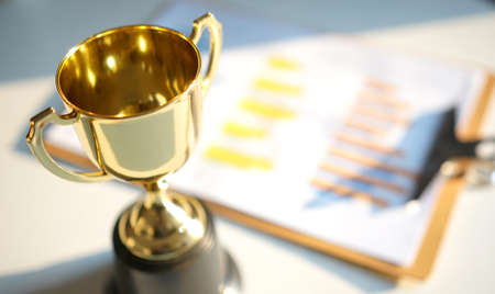 financial diagram with golden trophy on background. business successful concept                                    の写真素材