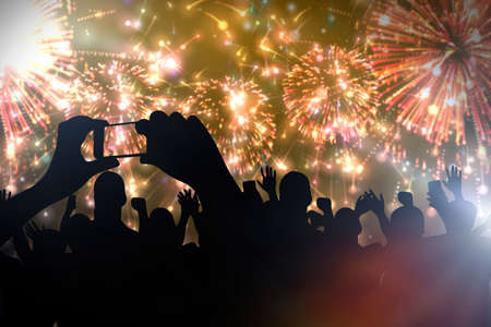 Cheering crowd and fireworks. Celebrating new yearâs partyの写真素材