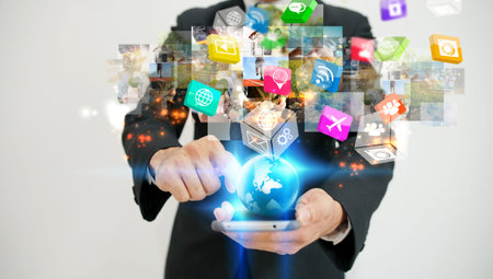 Businessman using smartphone. World connected, social media concept                                 ...