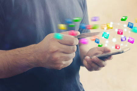 A man working with smartphone modern technology as social media concept