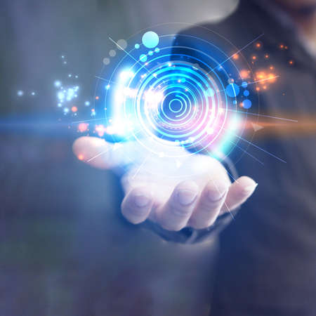 Abstract technology network. Glowing cycle on handの写真素材