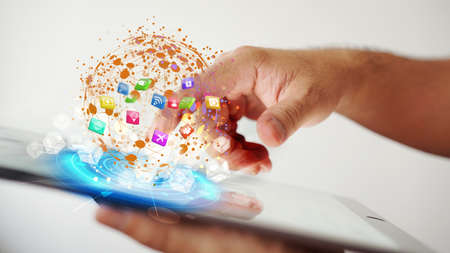 hand presses social media icons on screen digital tablet modern technology as social media connectingの写真素材