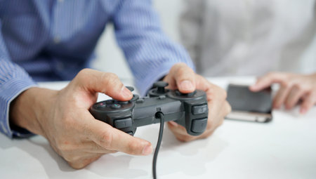 Happy couple playing video games with joysticks
