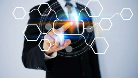 businessman pressing transparent button on virtual screens.                                の写真素材