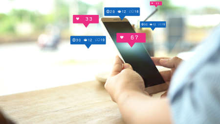 Social media and notification icons on smartphone. Media marketing concept.の写真素材