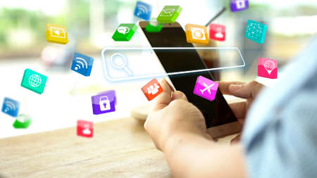 Hand using smartphone with Searching bar on screen. Data Networking Conceptの写真素材
