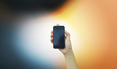 hand holding smartphone. connect to the future