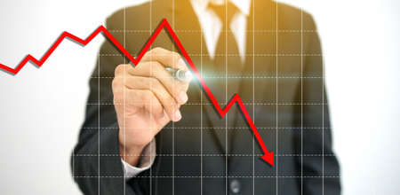 Businessman analysis  downing business trend graphの写真素材