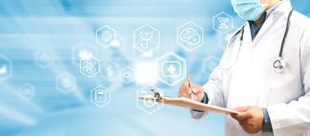 Doctor working in hospital and icon medical interface. Medical technology research institute conceptの写真素材