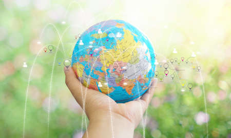 hand holding globe and network connection.の写真素材