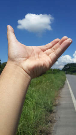 Hand holding cloud. Environment Conceptの写真素材