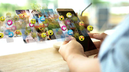 young woman using smartphone sending text messages emoticon icons. Social network concept, 3d renderingの写真素材