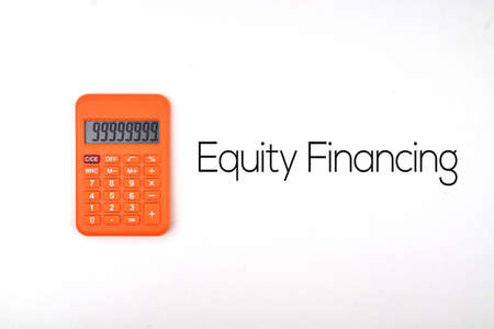 Selective focus image of calculator with Equity Financing wording on a white background. Business and economy conceptの写真素材