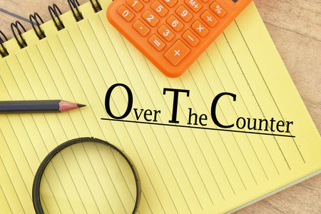 Selective focus image of calculator,pencil,magnifying glass with Over The Counter wording