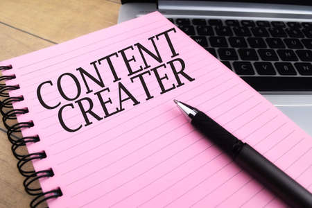 Selective focus image of pen and book with CONTENT CREATER wording. Business conceptの写真素材