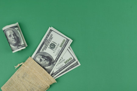 Selective focus image of bank note with copy space on green background