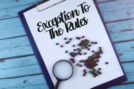 Selective focus image of spectacle glass and pen with declutter your life on a wooden backgroundの写真素材